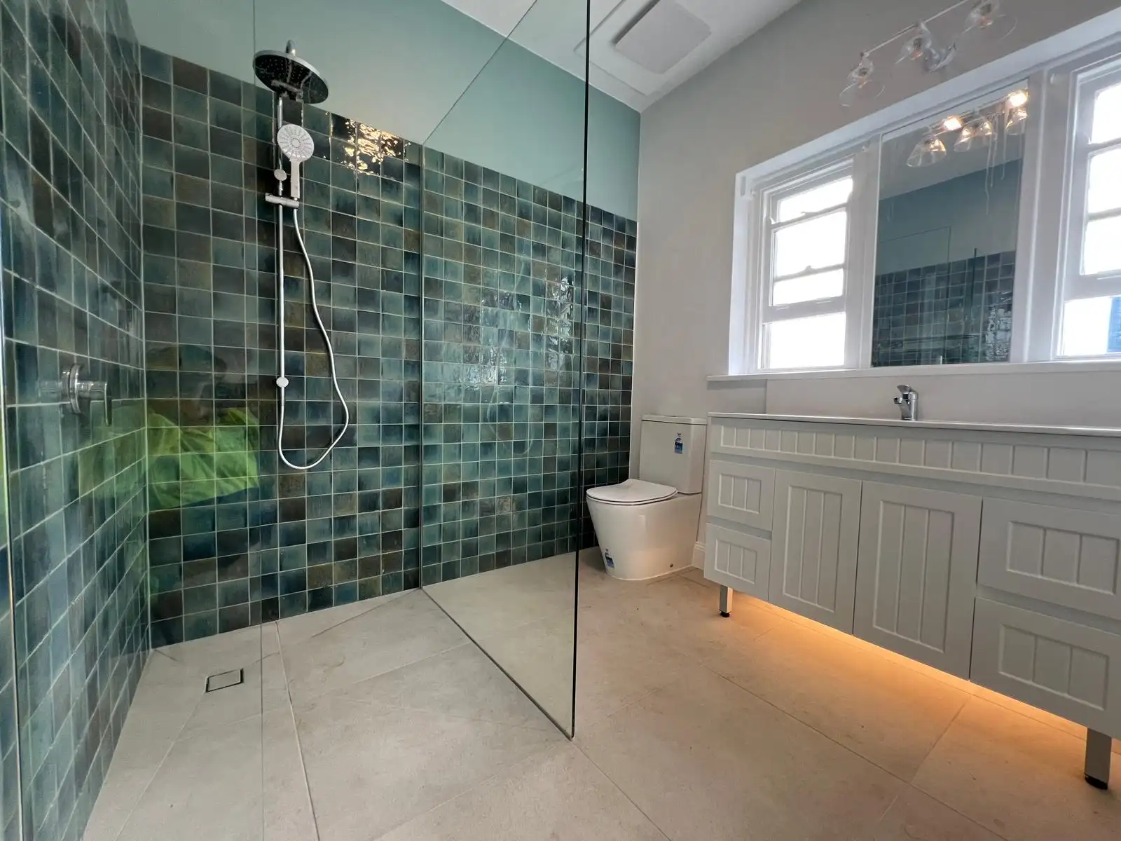 Outdoor alfresco patio tiled with slip-rated stone-look tiles