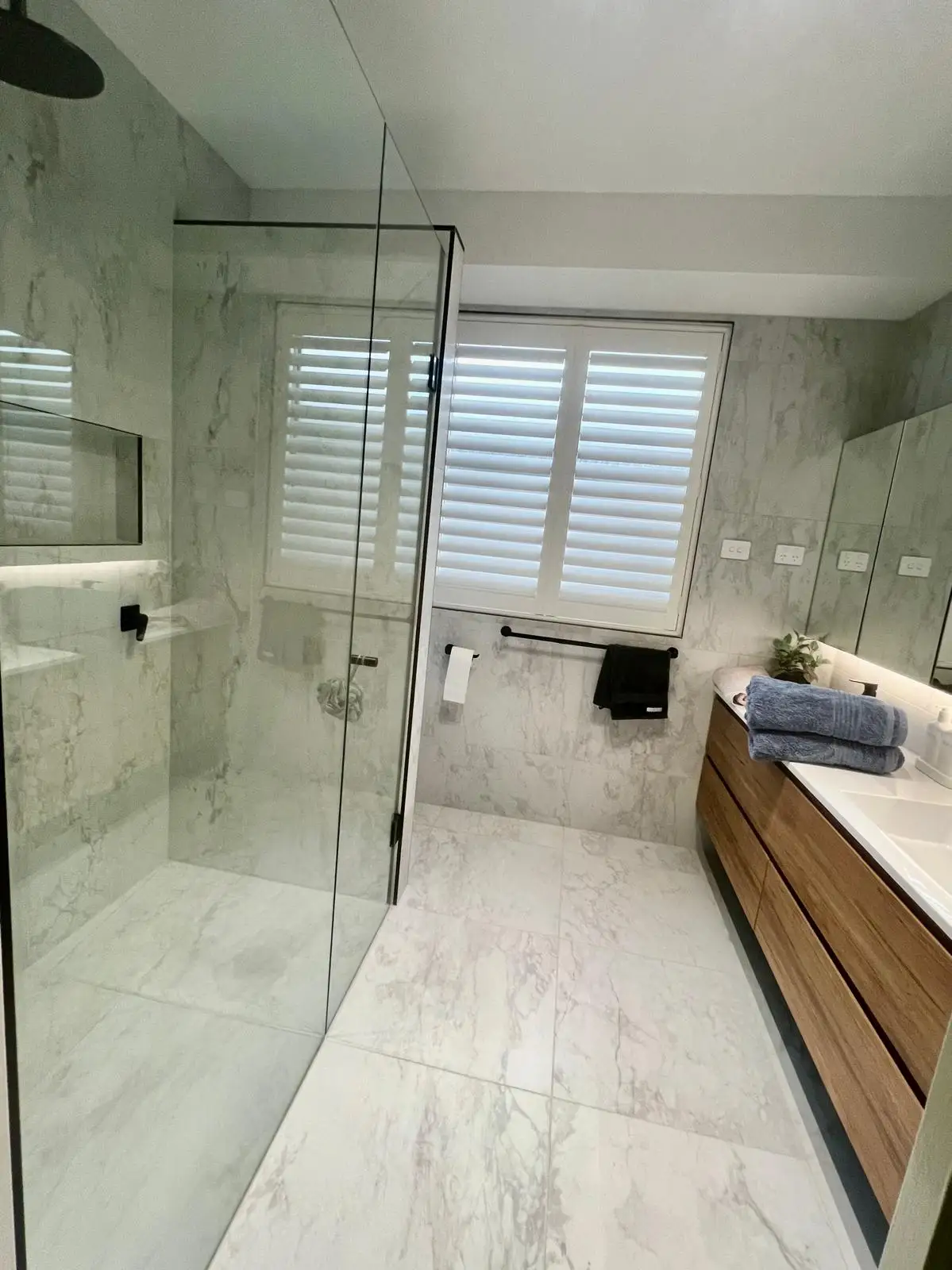 Commercial retail floor with large polished concrete-look tiles